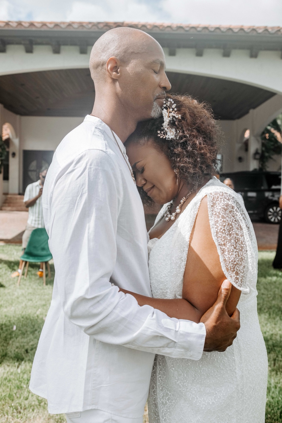 Emotional embrace at an intimate Spanish-style villa wedding in South Florida